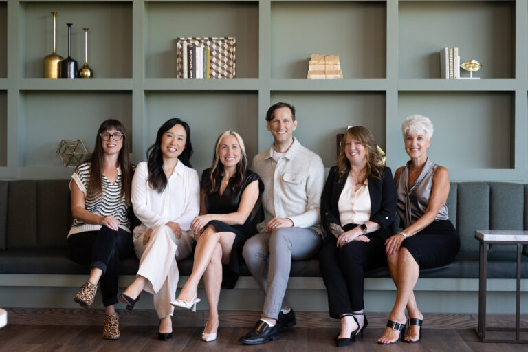 The six hosts of Your Portland Guide, local Portland Realtors, seated together