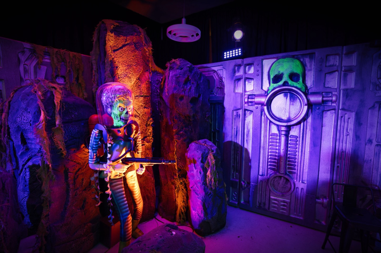 Alien encounter display inside the St. Helens museum, with glowing sci-fi props